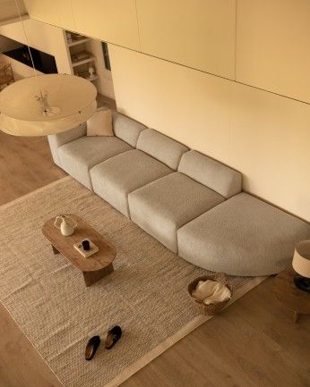 Bruce - Sofá de 4 módulos con curva de bouclé color gris claro 410x110cm