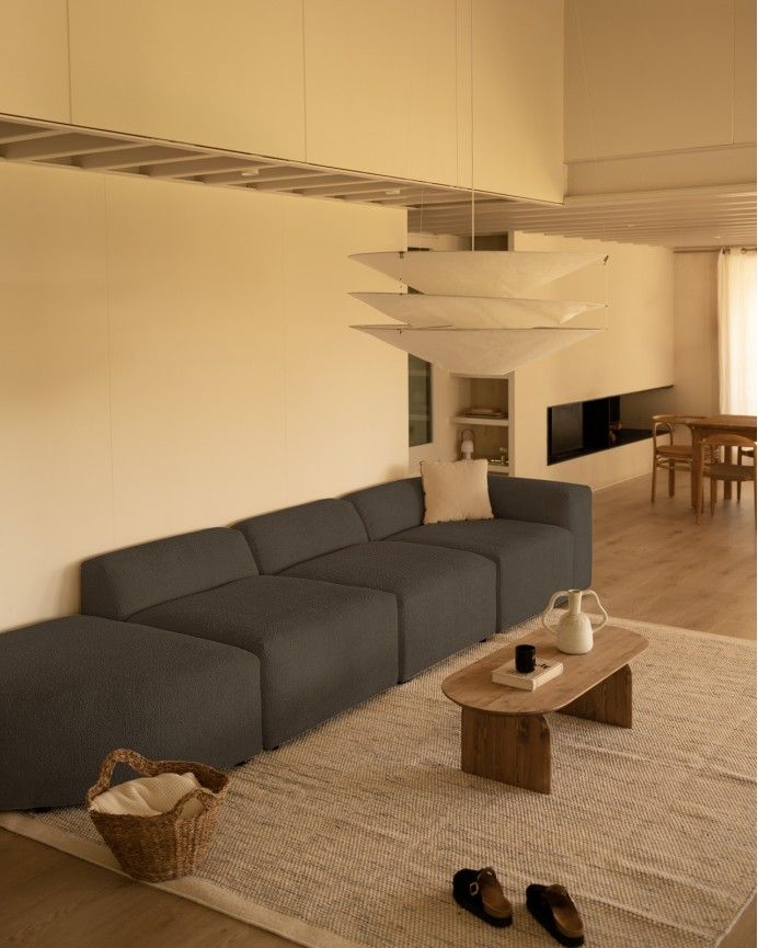 Bruce - Sofá de 4 módulos con curva de bouclé color gris oscuro 410x110cm