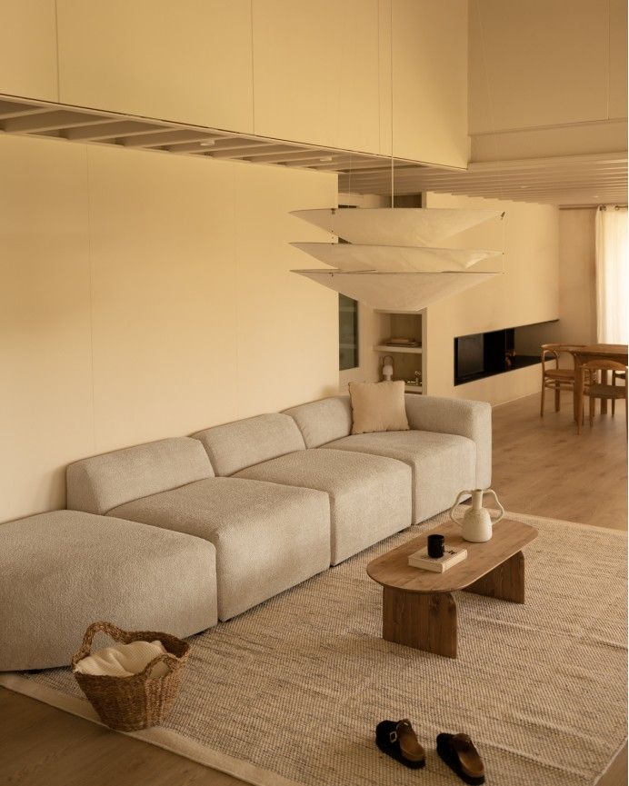 Bruce - Sofá de 4 módulos con curva de bouclé color gris claro 410x110cm